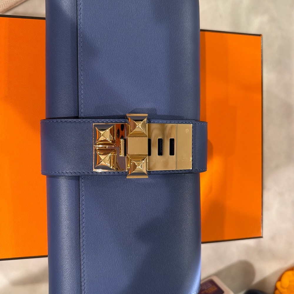 Hermes Blue Leather Clutch with Gold Pyramid Stud Lock